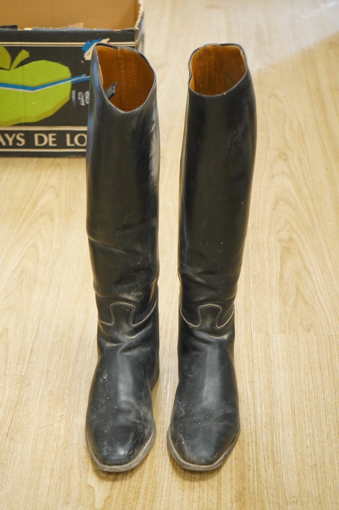 A pair of 20th century black leather riding boots